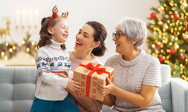 family opening Christmas present