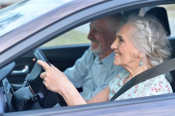 Senior couple driving